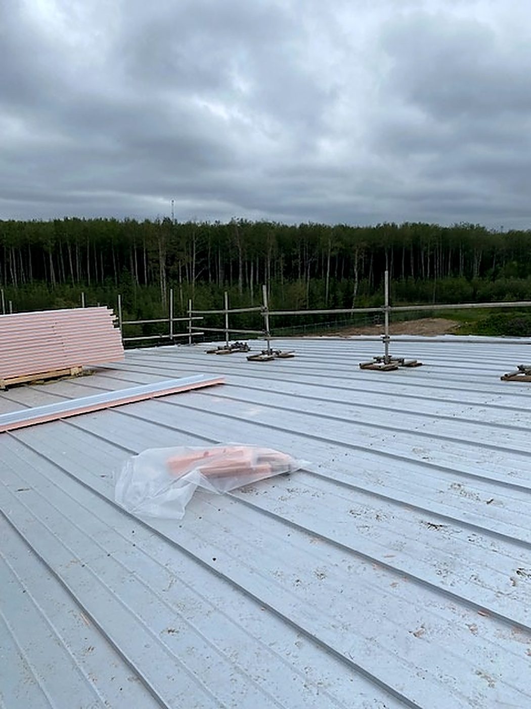 High-temperature polyiso insulation panels staged on the tank roof